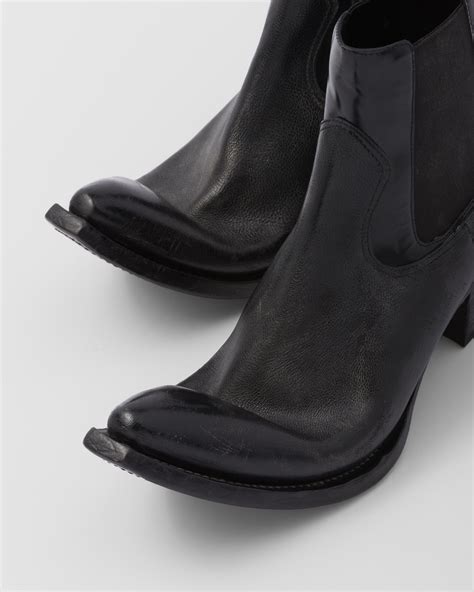 prada black booties.